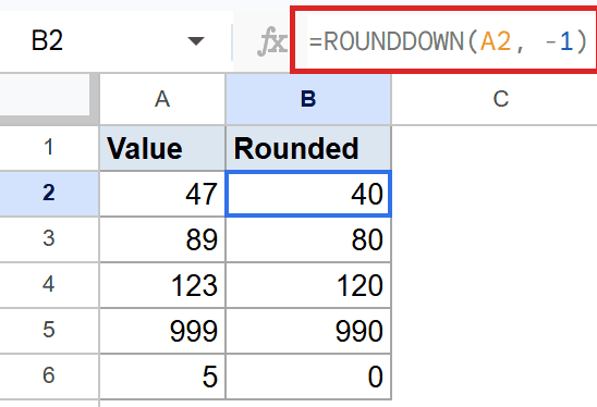 Google Sheet displays =ROUNDDOWN(A2, -1) in the formula bar, rounding 47 to 40.